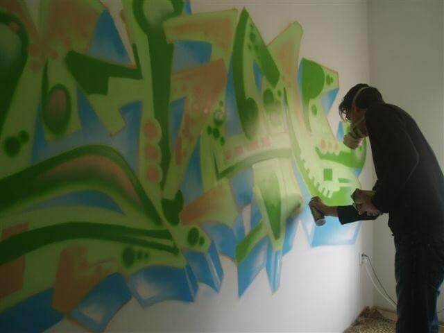 On a beautiful day, Stan's parents asked Theron if he could paint their son's name on the wall of his new room using graffiti letters. Theron took the mother's color choice into consideration and eagerly started the project. When he finished, the parents were extremely happy and proud of the result. The painting on the wall brought a smile to their faces, and they felt a great sense of satisfaction. It was a fun and creative addition to Stan's room that brought them joy.